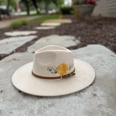 Sunflower Fedora Cream wide brim suede fedora with a sunflower and wildflowers embroidered on the side
